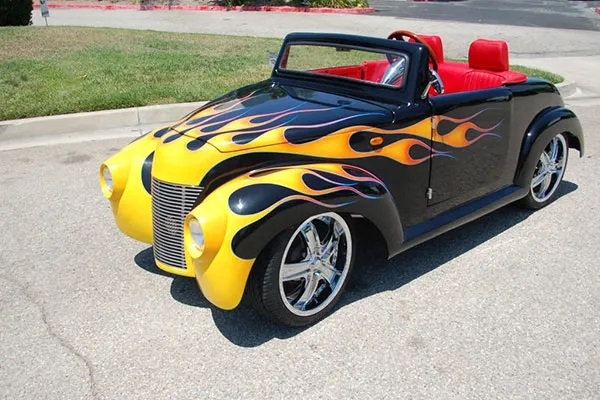 Black 39 Roadster with Yellow Flames affordable golf cart rental, golf cart rent greensboro