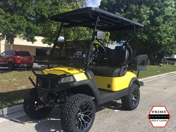Yellow Aluma 4 Passenger Lifted Golf Cart affordable golf cart rental, golf cart rent greensboro